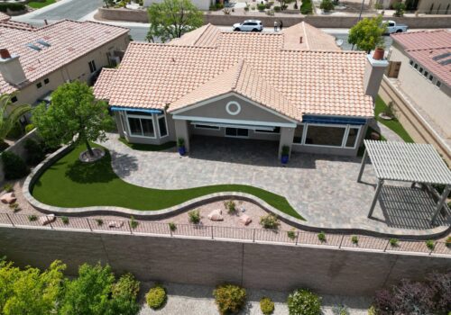 A house with a driveway and patio area.