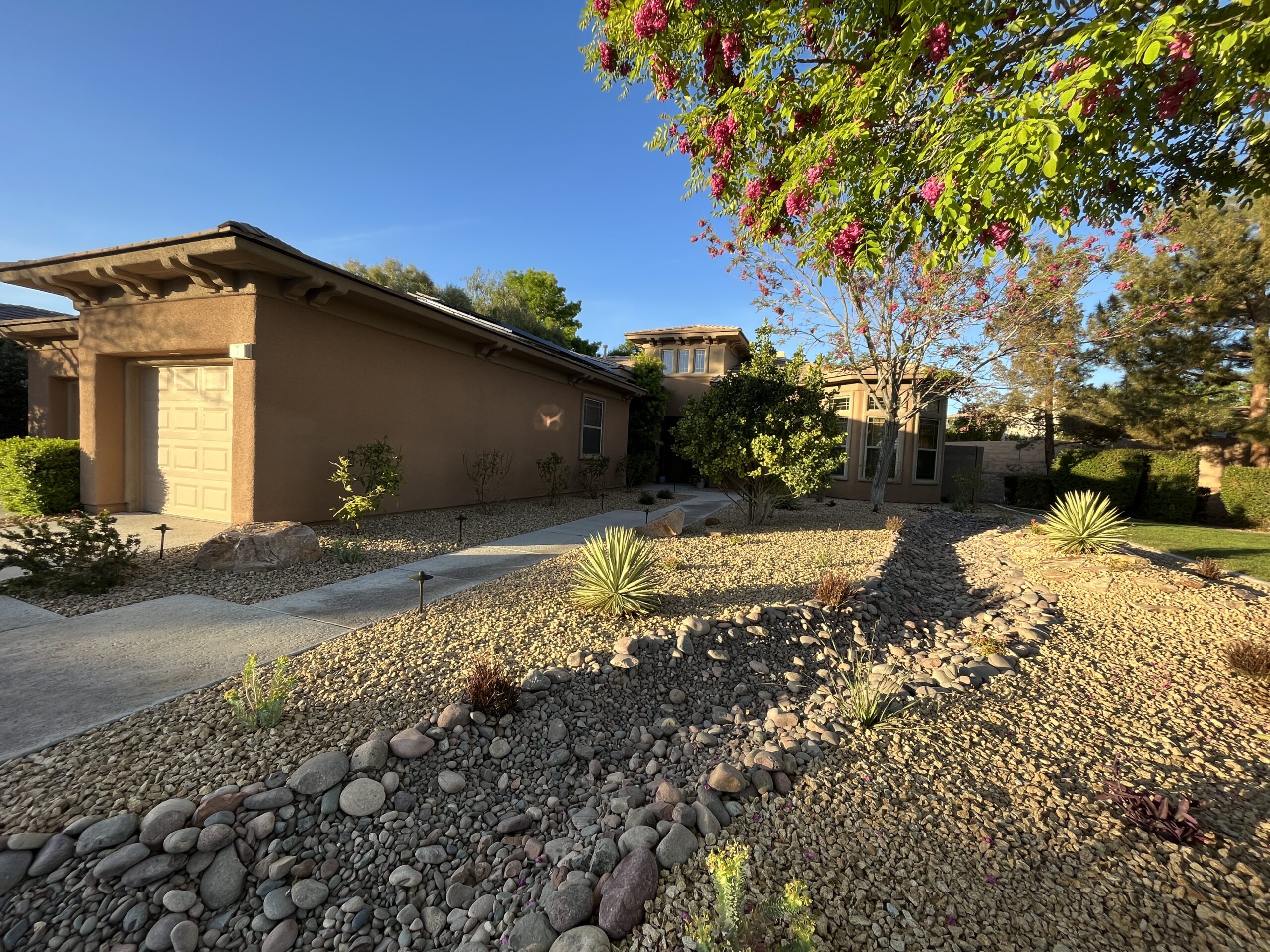 A house with a lot of rocks in front of it A house with a lot of rocks in front of it