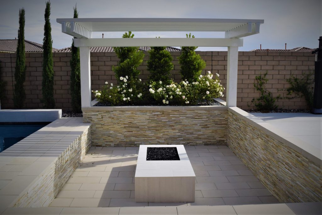 A fire pit in the middle of an outdoor patio area. A fire pit in the middle of an outdoor patio area.